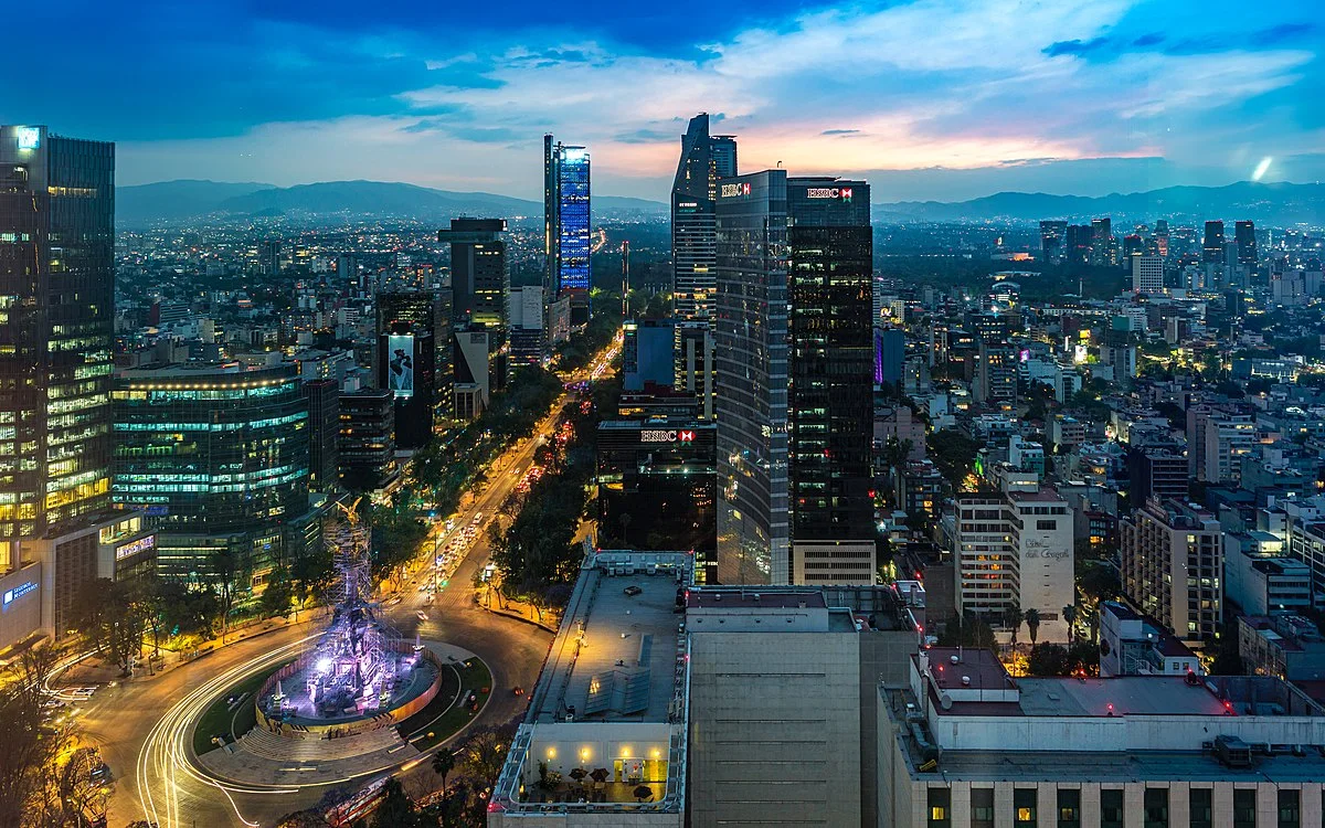BMNS - Cityscape View of Skyscrapers at Dusk with Vibrant Sky