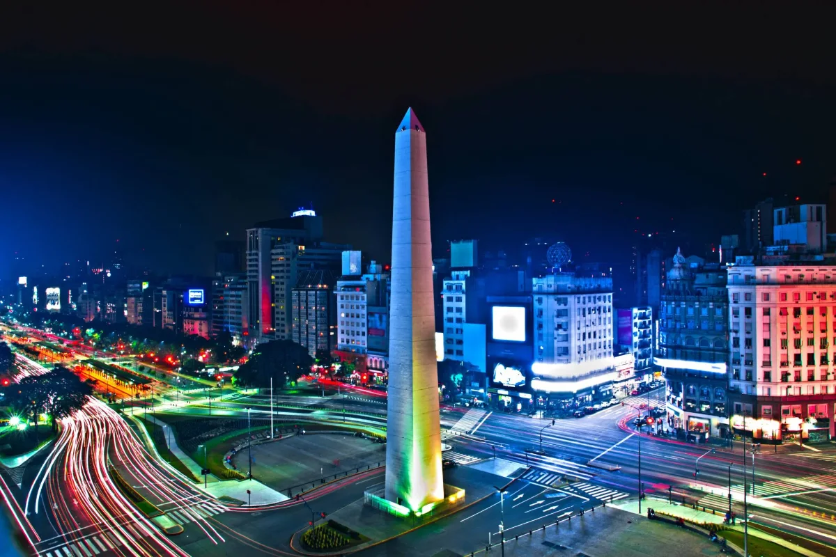 BMNS - Night view of a city with a tall obelisk monument