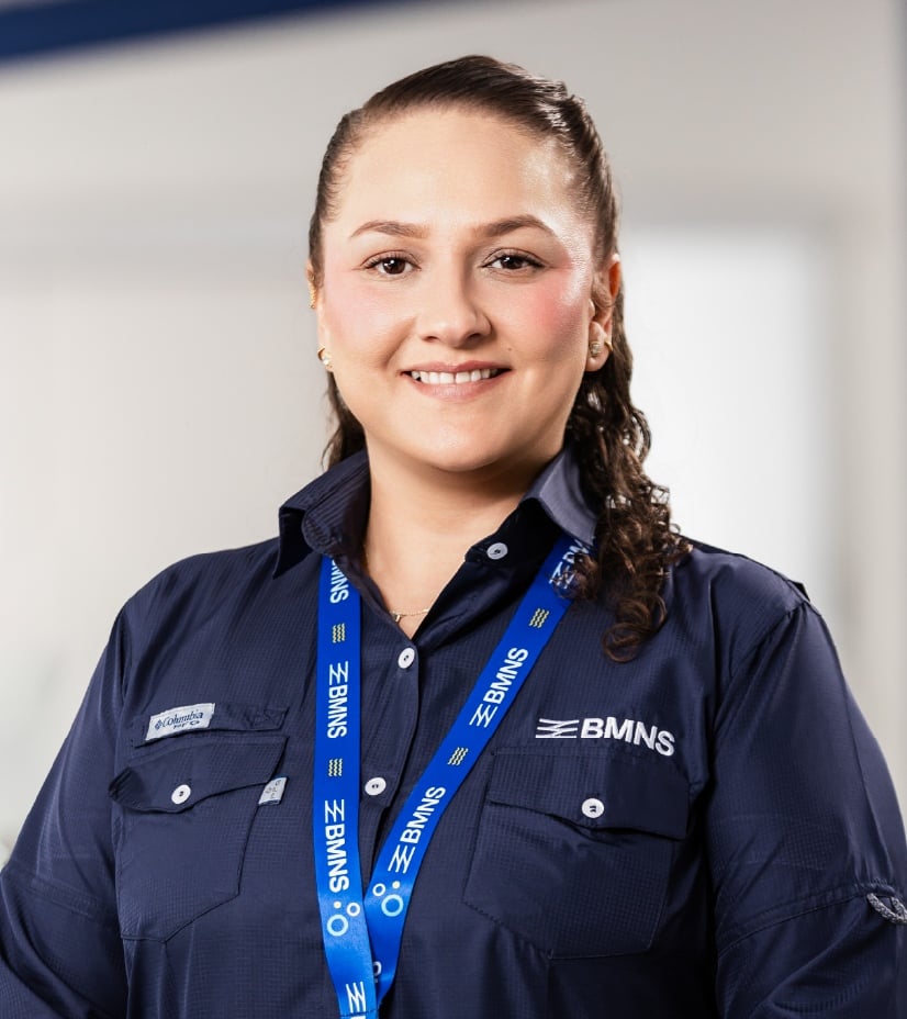 BMNS - Smiling professional with BMNS lanyard and blue shirt