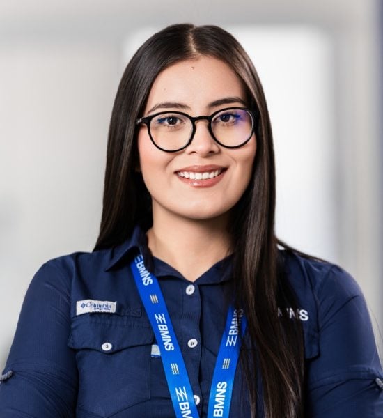 BMNS - Smiling professional with BMNS lanyard and blue shirt