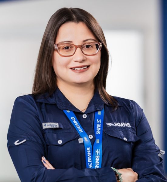 BMNS - Smiling professional with BMNS lanyard and blue shirt